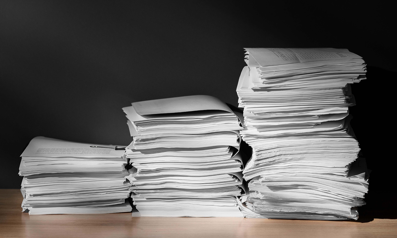 Documents (1500x900) Stack of documents on a desk