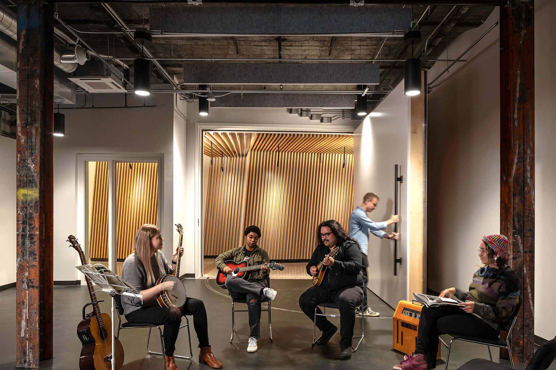 Artists playing musical instruments at Station Space in King Street Station